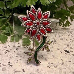 Christmas brooch of colorful Poinsetta